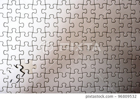Jigsaw puzzle background texture, last piece, 1 remaining piece, front view, light bulb color image with clear shadows 96809532