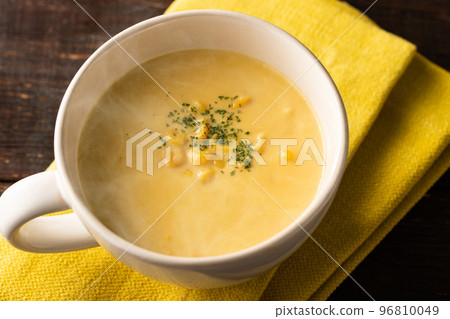 Warm corn potage soup with a gentle steam Warm corn potage soup with a gentle steam 96810049