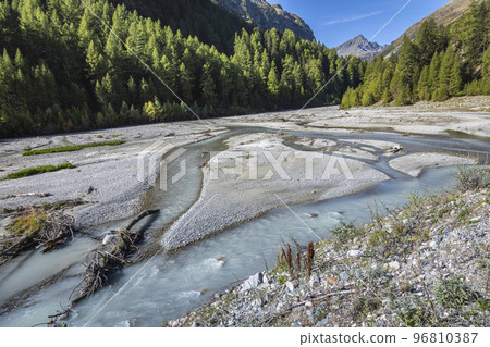 Alpine river in Engadin Valley at sunrise, Graubunden alps, Grisons, Switzerland 96810387