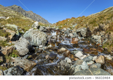 Alpine river in Engadin Valley at sunrise, Graubunden alps, Grisons, Switzerland 96810464