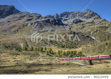 Swiss train in the alps mountains around Bernina pass, Engadine, Switzerland 96810499