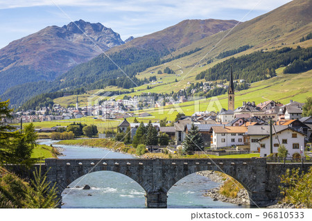 Idyllic landscape of village in Engadine valley, Swiss Alps, Switzerland Idyllic landscape of village in Engadine valley, Swiss Alps, Switzerland 96810533