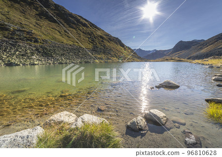 Alpine Lake at Fluela Pass in Graubunden alps, Grisons, Switzerland Alpine Lake at Fluela Pass in Graubunden alps, Grisons, Switzerland 96810628