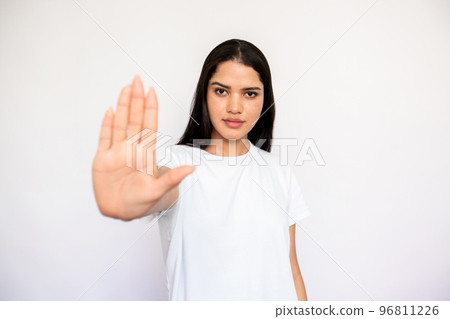 Portrait of confident young woman making refusal gesture 96811226