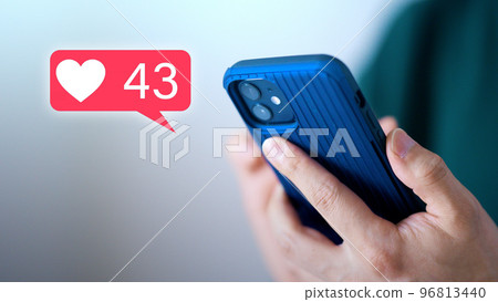 Male hand operating a smartphone 96813440