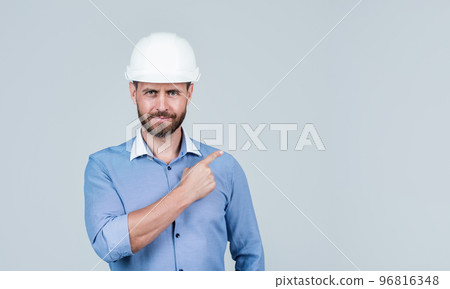 confident guy pointing finger on copy space. business project engineer. successful male ceo. 96816348