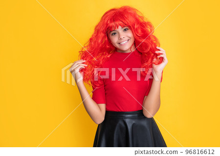 glad kid with red long hair on yellow background glad kid with red long hair on yellow background 96816612
