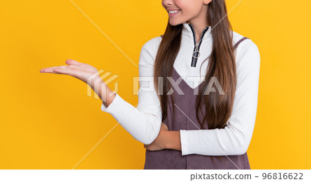 happy girl with long hair on yellow background 96816622