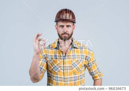 guy wear worker uniform. handsome builder in helmet. mature man wear checkered shirt guy wear worker uniform. handsome builder in helmet. mature man wear checkered shirt 96816673