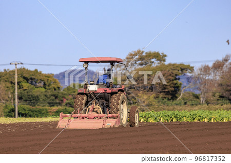 tractor plowing the field tractor plowing the field 96817352