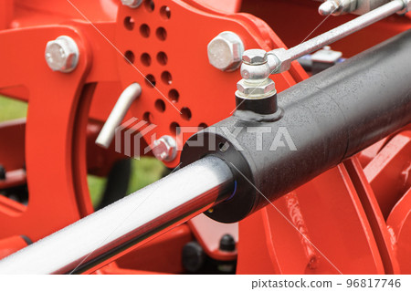 Black piston or actuator in red pneumatic or hydraulic machine. Technology Black piston or actuator in red pneumatic or hydraulic machine. Technology 96817746