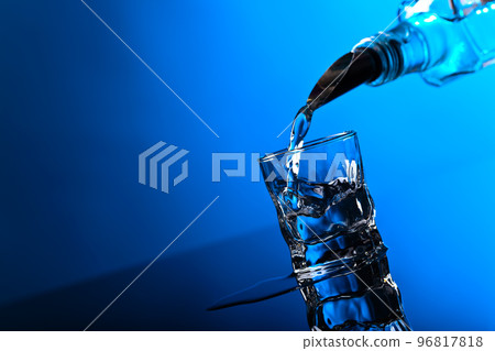 vodka in bar on a black background vodka in bar on a black background 96817818