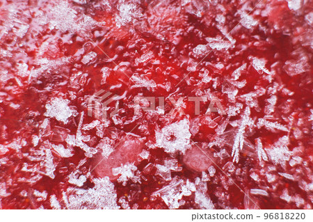 Mashed red fresh frozen strawberries background closeup Mashed red fresh frozen strawberries background closeup 96818220