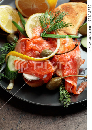 Sandwich with salmon and greens. Sandwich with salmon and greens. 96818752