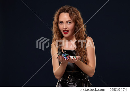 Casino concept. Portrait of young pretty caucasian woman, playing in casino. Roulette, poker chips, cards, wheel, isolated white background 96819474