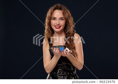 Casino concept. Portrait of young pretty caucasian woman, playing in casino. Roulette, poker chips, cards, wheel, isolated white background 96819476