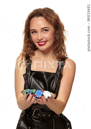 Casino concept. Portrait of young pretty caucasian woman, playing in casino. Roulette, poker chips, cards, wheel, isolated white background 96819481