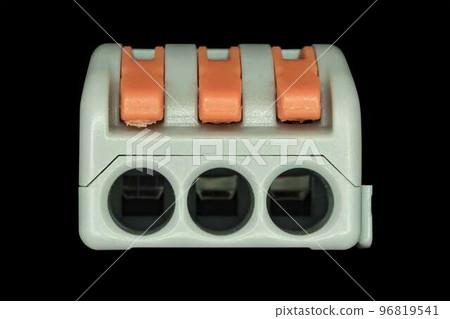 Compact splicing connector isolated on black background. 96819541