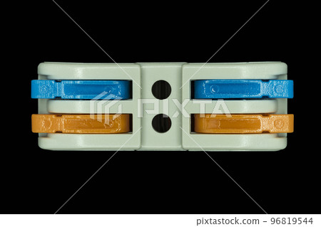 Compact splicing connector isolated on black background. 96819544