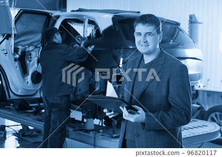 Auto mechanic and technician working in repair shop Auto mechanic and technician working in repair shop 96820117