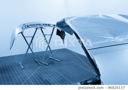 Car bumper after painting. Drying parts of the automobile in spray booth. 96820137