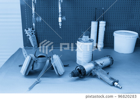 airbrush for car painting, spray gun in auto repair shop airbrush for car painting, spray gun in auto repair shop 96820283