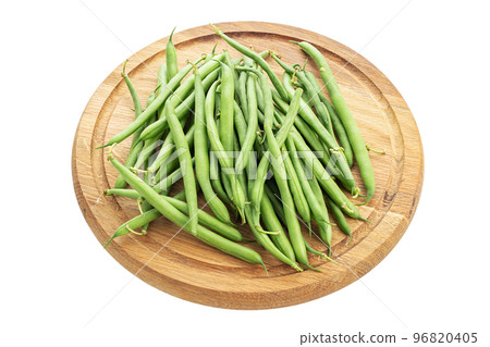 Green beans handful on a cutting board isolated on white background. 96820405