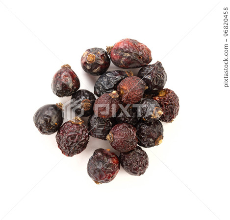 Heap of red dry rose hips isolated on a white background. Heap of red dry rose hips isolated on a white background. 96820458
