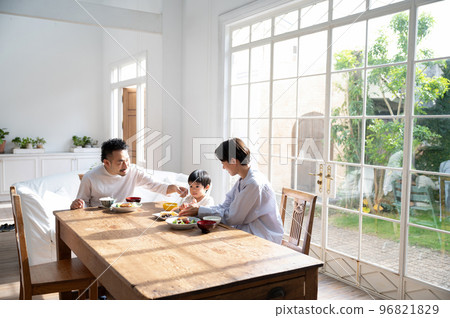 Dining table with children who love rice Faceless wide-angle copy space available 96821829