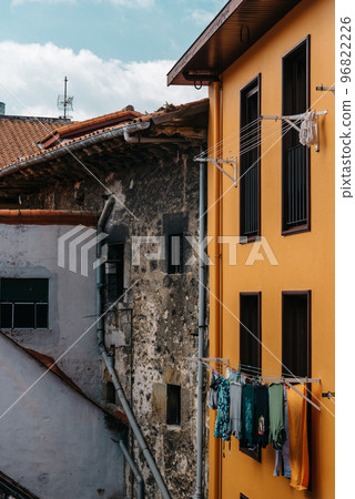 Clothes hanging on the facade of a house in the historic center of a town 96822226