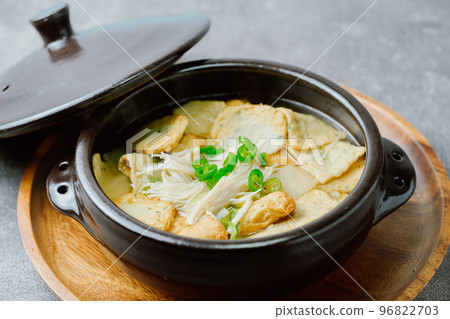 Korean food fish cake soup dish in black earthenware pot 96822703