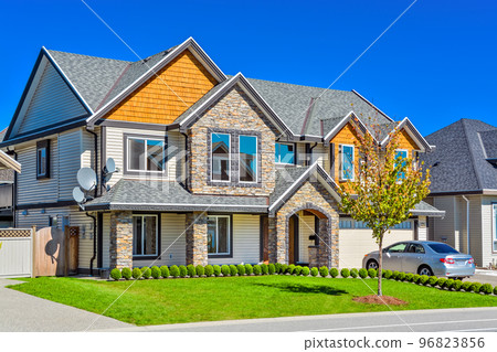 A perfect neigborhood. Luxury residential house with wide garage door 96823856