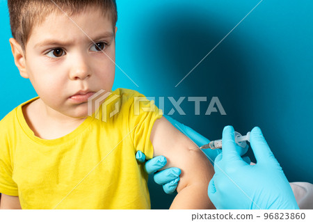 The doctor or nurse injects the child in the arm' in the shoulder. The concept of vaccination in health and medicine, vaccines for children. BCG tuberculosis, DPT. The doctor or nurse injects the child in the arm' in the shoulder. The concept of vaccination in health and medicine, vaccines for children. BCG tuberculosis, DPT. 96823860