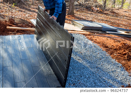 Putting together plastic shed for backyard that will be used for storage Putting together plastic shed for backyard that will be used for storage 96824737