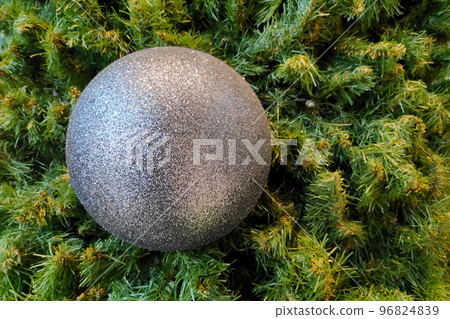 Glittererd silver ball on christmas tree Glittererd silver ball on christmas tree 96824839