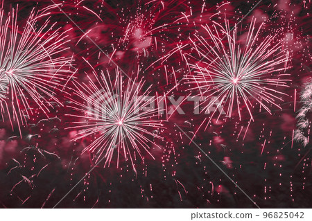 Holiday fireworks with sparks, bright nebula, smoke on sky. Festive holiday background, burgundy magenta color Holiday fireworks with sparks, bright nebula, smoke on sky. Festive holiday background, burgundy magenta color 96825042