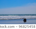Two surfers resting on the beach in Miyazaki Prefecture 96825458