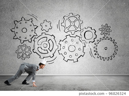 King businessman in elegant suit running in empty room with wooden floor 96826324