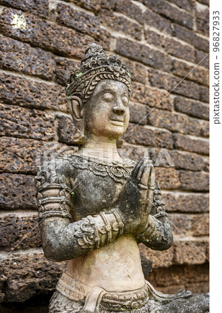 Wat Jed Yod, built in 1497, is a large active temple where monks live and study, and is seldom Wat Jed Yod, built in 1497, is a large active temple where monks live and study, and is seldom 96827933