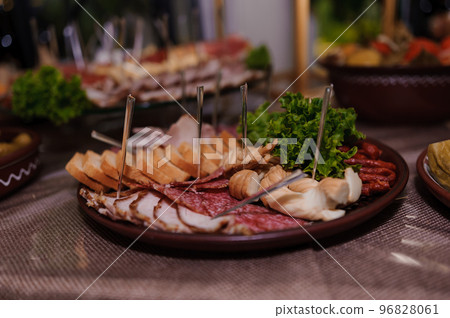 Slicing different varieties of meat 96828061