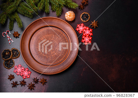 Christmas table with empty plate and surface with New Year's decorations 96828367