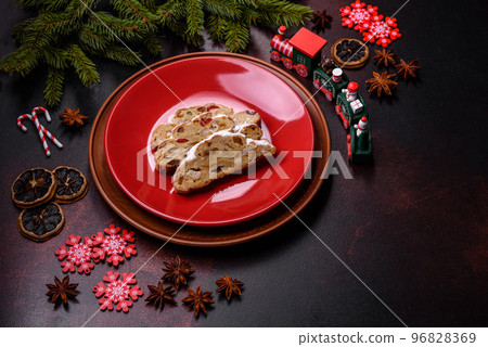 Tasty christmas stollen with marzipans, dried fruits and nuts Tasty christmas stollen with marzipans, dried fruits and nuts 96828369