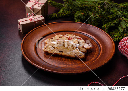 Tasty christmas stollen with marzipans, dried fruits and nuts 96828377