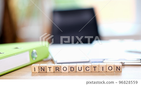 Word Introduction on office desk and empty chair in background. Word Introduction on office desk and empty chair in background. 96828559