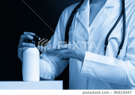 Female hands pushing pump plastic soap bottle with copy space, using wash hand sanitizer gel pump dispenser. killing germs, bacteria and virus Female hands pushing pump plastic soap bottle with copy space, using wash hand sanitizer gel pump dispenser. killing germs, bacteria and virus 96828947