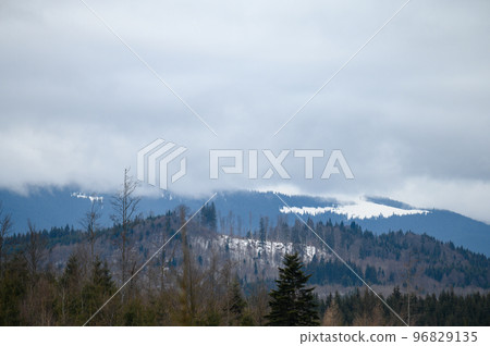 Wonderful views of the Carpathian Mountains covered with snow and a clear blue sky in Ukraine. Wonderful views of the Carpathian Mountains covered with snow and a clear blue sky in Ukraine. 96829135