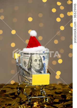 Christmas and New Year's Shopping - Cart, Bag and Dollars. Holiday Discounts and Sales Christmas and New Year's Shopping - Cart, Bag and Dollars. Holiday Discounts and Sales 96829446