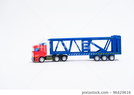 Toy car transporter with cars on a white background with place for text, copy space, for a toy store. 96829616