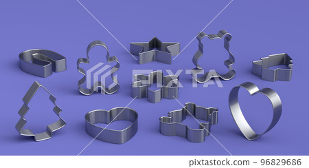 Set of metal cookie cutters for homemade Christmas biscuit on a violet 96829686