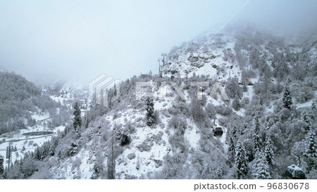 Cable car in the mountains in the winter forest Cable car in the mountains in the winter forest 96830678